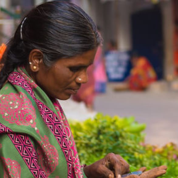 The state of Andhra Pradesh (AP) had become one of the most competitive microfinance markets in India during this time. But, the AP government started to become uneasy with the outsized impact and influence of commercial MFIs, however. Increased competition led to excessive lending, with many clients taking out multiple loans from both SHGs and commercial MFIs. Average household debt in AP rose to about INR 65,000 compared to a national average of about INR 70,001. The MFIs were accused of harassing customers for repayment. The suicide rate spiked, and the state government began attributing some of these suicides to excessive lending by the MFIs and coercive loan recovery practices. This case study tells the story of how a microfinance crisis in India's Andhra Pradesh nearly wiped out Spandana, a promising and quickly growing non-bank financial institution in 2010, and how it embarked on a long gradual recovery that culminated in a successful IPO.
