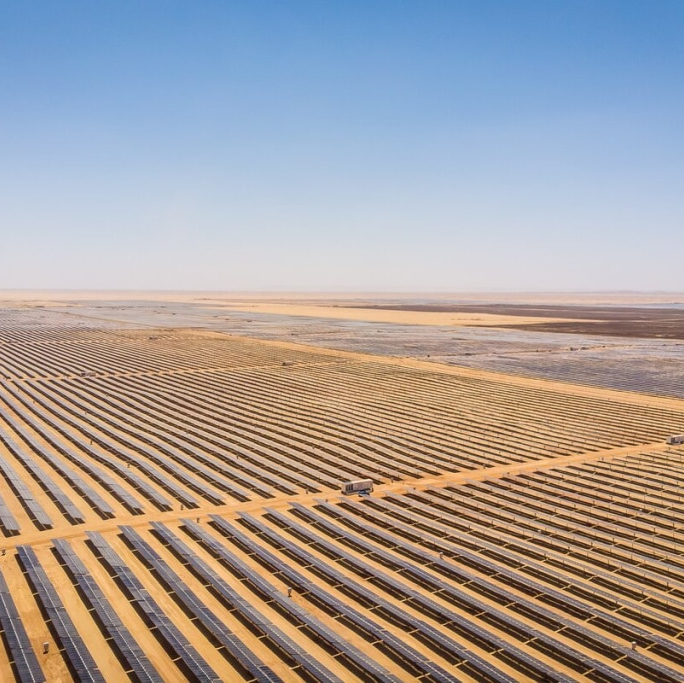 Challenges to Investment&nbsp;&nbsp;Launched in 2014, Egypt's Feed-in Tariff (FiT) program was established to tackle key obstacles within the renewable, especially solar, energy sector. Prior to the FiT's introduction, the absence of financial incentives deterred investment in solar energy projects, rendering them unappealing to both domestic and international investors and leading to a diminished interest in solar energy. The FiT scheme offered investors assured returns, enhancing the financial attractiveness of solar projects and providing a structured approach for their installation and maintenance.&nbsp;Approach&nbsp;In 2014, Egypt introduced its Feed-in-Tariff (FiT) scheme over two rounds, initially setting a target of installing 2500 MW of renewable energy capacity. In its first round, the government set a rate of 14.3 US cents per kilowatt-hour for solar photovoltaic (PV) projects ranging between 20 to 50 MW to jumpstart the market. The second round adjusted these rates to reflect decreasing global prices, setting a competitive tariff of 8.40 US cents/kWh for projects from 20 to 50 MW. This effectively addressed the first round challenges, including arbitration, and successfully rolled out 1.8 GW of additional renewable energy projects. This initiative included the Nubian Suns project, spearheaded by the International Finance Corporation (IFC), which funded 13 solar PV projects near Aswan, collectively generating 752MWp/590MWac. The IFC helped Egypt implement a strategic approach that enabled project financing for smaller-scale projects. This strategy was based on a uniform set of terms and conditions agreed by both sponsors and banks, simplifying the complicated process of consolidating multiple projects. This innovative approach for the second round of the feed-in-tariff framework secured the title of Global Multilateral Deal of the Year at the PFI Awards 2017.&nbsp;Key Enabling Conditions&nbsp;The Egyptian government's 2035 Integrated Sustainable Energy Strategy laid the groundwork for clean energy initiatives. This strategy, along with international collaboration and financial support helped foster broader investments in renewable energy infrastructure. Furthermore, the World Bank helped the Egyptian government create a conducive regulatory environment by introducing policy reforms and catalyse private sector investments in clean energy. The IFC also helped orchestrate a USD 653 million deal, which included syndicated loans. This innovative financial arrangement brought together a consortium of 18 developers, grouped into six sponsor teams, and 11 financial institutions, showcasing a successful model of public-private partnership for clean energy development.Impact / OutcomesThe program garnered significant interest from investors, with over 20 groups preparing proposals by early 2016, aiming to finalize Power Purchase Agreements (PPAs). The FiT program was instrumental to advancing ventures including the Benban Solar Park, which stands as one of the largest solar power installations globally, encompassing 32 power plants over an area of 37 square kilometers. This flagship project, along with others, funded through the FiT scheme, sought to produce affordable and renewable electricity, provide power to numerous households, avoid carbon emissions, and generate employment during construction. The initiative also received backing from global institutions, including key players such as the IFC,the European Bank for Reconstruction and Development (EBRD), and the French Development Agency (Proparco).By 2017, this initiative had successfully revitalized the renewables sector, drawing in $2 billion from private investors. This influx of investment significantly boosted Egypt's renewable energy output, with an impressive addition of 28,229 MW to the national grid between December 2015 and December 2018 (total capacity to 55 GW). Additionally, the government's efforts to upgrade and expand the distribution grid were crucial in seamlessly incorporating renewable energy sources into the country's power infrastructure. This resulted in an increase in the share of renewable energy in total electricity generation, reaching 12% in 2021. Moreover, solar energy generation increased approximately twentyfold since the introduction of the feed-in-tariff in 2014, until 2021.&nbsp;As private sector engagement is a top priority for Egypt, de-risking tools were deployed and have been instrumental to further&nbsp;enable private sector involvement. The Multilateral Investment Guarantee Agency (MIGA) provided political risk insurance for the construction, operation and maintenance of a number of solar power plants projects in support of Egypt's Solar Feed in Tariff (FiT) program.The EBRD, on the other hand, provided up to USD 500 million in loans to multiple private developers through special purpose vehicles to develop, construct and operate their respective subprojects.&nbsp;Additionally, it provided the Egyptian authorities with technical assistance for the preparation of the Solar Grid Code and the Strategic Environmental and Social Assessment (SESA) for the Benban solar site in Egypt, maximising the benefits for the local population and other stakeholders.Additional SourcesInternational Energy Agency, “Energy Statistics Data Browser: Egypt”, 21 December 2023, https://www.iea.org/data-and-statistics/data-tools/energy-statistics-data-browser?country=WORLD&amp;fuel=Energy%20supply&amp;indicator=TESbySourceInternational Renewable Energy Agency, “Energy Profile: Egypt (2023)”, https://www.irena.org/-/media/Files/IRENA/Agency/Statistics/Statistical_Profiles/Africa/Egypt_Africa_RE_SP.pdf﻿UNESCAP. (n.d.). Feed-In Tariff. Retrieved April 8, 2024, from unescap.org/sites/default/files/26. FS-Feed-In-Tariff.pdfhttps://pressroom.ifc.org/all/pages/PressDetail.aspx?ID=17490https://www.cliffordchance.com/content/dam/cliffordchance/briefings/2018/02/egypt-solar-feedin-tariff-round-2.pdfhttps://www.ebrd.com/work-with-us/projects/psd/egypt-renewable-feedintariff-framework.html