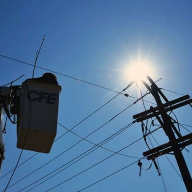 Challenges to investment&nbsp;Mexico’s energy reform (2013-2014) transformed the state-owned electricity company, the Federal Electricity Commission (Comision Federal de Electricidad, CFE) into a holding company with exclusive rights over transmission and distribution. However, the national energy grid came under the supervision of the independent National Energy Control Center (Centro Nacional de Control de Energía, CENACE), which guaranteed access to the transmission and distribution networks. The idea was to provide equal conditions for all market participants. However, underinvestment and outdated guiding frameworks and compliance standards threatened the grid stability, where the grid was fully utilized (saturated) and demand exceeded the grid’s capacity to carry power (congestion). As a result, overcharges, disruptions, and blackouts led to inefficiencies and an unreliable electric supply. Hence, Mexico needed to develop a new set of technical and operational regulations in order to ensure safety, reliability, and efficiency.&nbsp;Approach&nbsp;On 8 April 2016, the initial Grid Code (Código de Red, GC) became mandatory in Mexico, and had been updated several times since then. The GC is an official document outlining a series of rules and technical criteria set by the Energy Regulatory Commission (Comisión Reguladora de Energía, CRE). All users of the electricity system are required to comply with the GC, including generators, transmission and distribution agents, business consumers and all load centers connected at medium and high tension, regardless of their consumption level.The GC sets national standards in efficiency, quality, reliability, continuity, safety, and sustainability for the electric system. Specifically, mid- and high-tension users with a demand greater or equal to 1 MW have to maintain an average power factor of at least 0.95 during 95% of the time. Th GC also states that power factor might only drop below 0.95 for up to 36 hours during a month. Failure to comply with the GC could be sanctioned with (i) a penalty of 2-10% of the company’s previous year gross income revenue or (ii) a penalty of 50,000 to 200,000 times the daily minimum wage, depending on the degree of violation.Key Enabling Conditions&nbsp;The urgency of providing reliable electricity supply and avoiding economic costs forced the CRE to address grid stability by implementing new compliance rules. The updated grid code, in adherence to the mandate of the Energy Reform, demonstrated the commitment to keep up the requirements as technologies and new market conditions advanced.&nbsp;Impact / OutcomesOne key outcome of the GC has been the reliable standards for the National Electric System (Sistema Eléctrico Nacional, SEN)’s operational and planning activities. In addition, Mexico’s electric infrastructure improved in terms of measurement, control, and usage. The average total duration of outages (in hours) experienced by a customer in a year declined from 0.79 in 2014 to 0.58 in 2019. Along with other reforms (i.e., General Act on Climate Change [2012], Energy Reform [2013], Energy Transition Act [2020]), the GC supported the integration of renewable energy sources by establishing specific conditions for their connection and operation. Between 2017 and 2021, generation from renewable sources grew from 19% to 27%. Finally, the GC set equitable rules for all users and thereby encouraged competition as well as new market entries. Thus, consumers benefited from competitive prices and technological innovations.Additional SourcesChanona Robles, A. (2016), Tracking the progress of Mexico’s power sector reform, https://www.wilsoncenter.org/sites/default/files/media/documents/publication/tracking_progress_of_mexicos_power_sector_reform.pdfGeddes, A., et al. (2020), Rethinking Eskom: Lessons from electricity sector reform in India and Mexico, https://www.iisd.org/system/files/publications/rethinking-eskom.pdf IMCO (2022). The Energy Mexico needs: Infrastructure, Regulation, and Rule of Law for a Sector that Triggers the Country’s Competitiveness, https://imco.org.mx/en/wp-content/uploads/2024/04/The-energy-Mexico-needs-2022.pdf IRENA (2022). Grid Codes for Renewable Powered Systems, https://www.irena.org/-/media/Files/IRENA/Agency/Publication/2022/Apr/IRENA_Grid_Codes_Renewable_Systems_2022.pdf Linvill, C., Brutkoski, D. (2017), Designing Distributed Generation in Mexico, https://www.nrel.gov/docs/fy17osti/66026.pdf https://enerlogix-solutions.com/en/grid-code-compliance/ https://www.globalcompliancenews.com/2022/01/24/mexico-energy-regulatory-commission-issues-new-network-code130122/ https://grupoindustronic.com/en/how-important-is-the-grid-code/ https://mexicobusiness.news/energy/news/new-house-rules-grid-code-20 https://prosperitydata360.worldbank.org/en/indicator/WB+DB+55 