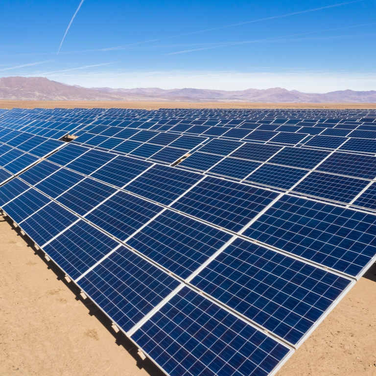 Challenges to investment&nbsp;In June 2022, the Government of Tunisia (GoT) set a target for renewable energy (RE) to represent 35% of total power generation by 2030. The target translated to an annual investment of TND 900 million (about $300 million) through 2030. That investment would finance an additional 4 GW of RE capacity, rapidly expanding the existing 472 MW of installed capacity as of March 2022. Before setting the RE generation target, Tunisia already committed to strengthening and reinforcing the transmission network, as well as to improving energy efficiency. At that time, transmission, distribution, and generation in Tunisia were the responsibility of the state-owned monopolistic electricity company, Société Tunisienne de l’Electricité et du Gaz (STEG). However, STEG’s poor commercial performance – net profits had been negative since 2010 – and inadequate transmission system had dampened investors’ trust in STEG as a credible off-taker of privately-produced RE.&nbsp;&nbsp;Approach&nbsp;To effectively integrate the planned RE capacity, the existing transmission grid required expansion and upgrading. To achieve that objective, the GoT in collaboration with STEG, formulated three projects: the Energy Sector Improvement Project (ESIP), the Project to Develop and Equip the Power Transmission Grid (PAERTE), and the Smart Grid Project (SGP).&nbsp;The Energy Sector Improvement Project (ESIP) was approved on 24 June 2019, with the goal of both (i) strengthening the electric transmission system and (ii) advancing STEG’s commercial performance and financial viability. The ESIP focused on financing investments in transmission capacity that are critical to integrating private RE generation. Key targets included increasing the transmission capacity along the South-North corridor by 3,090 MW and constructing 384 km of transmission lines by 30 June 2024. The project’s total funding amounts to $151 million, with $131 million allocated to the transmission network and $20 million to enhance STEG’s commercial performance, supported by the World Bank (WB).&nbsp;Another important project was the Transmission Network Development and Equipment Project (PAERTE), which was designed to enhance transmission and improve electricity supply in the governorates of Bizerte, Ben Arous, Sousse, Sfax, and Gabes. Like the ESIP, the PAERTE aimed to expand and strengthen the national grid to accommodate the planned RE capacity, with a goal of constructing 246 km of new transmission lines and improving the transmission system processing power targeting 66,766 Megavolt-ampere (MVA) in 2022. This project, funded by multiple donors, amounted €290 million. The African Development Bank loaned €108 million, the Africa Growing Together Fund provided €30 million as a loan, the Islamic Development Bank contributed €121 million, and the implementing agency, STEG, contributed €31 million. At its outset, the project was set to be implemented between 2020 and 2023, but the planned completion date was rescheduled to 31 December 2024.&nbsp;Finally, the French Development Agency (Agence Française de Développement, AFD) financed the Smart Grid Project (SGP) with €120 million. This project focused on three components: (i) improving infrastructure assets, (ii) rolling out smart grids to balance power supply with demand, and (iii) enhancing financial payment flows by adopting a modern billing system. The program will consist of two phases: During the first phase (2022-2025), the project has begun to deploy the smart grid network in a pilot region covering Sfax city and Kerkennah, Sousse city and Sidi Bouzid, and Le Kram and Beja. This phase involves developing control and communication stations and improving infrastructure by installing 430,000 smart meters. The second phase (2026-2030) will extend the smart grid network to Tunisia's most populous areas, including the capital city, Tunis.&nbsp;&nbsp;Key Enabling Conditions&nbsp;The anticipated success of the three transmission projects relied on experience, reputation, and coordination with partners. The WB’s global expertise in these areas, coupled with its tailored energy programs, facilitated a comprehensive solution for Tunisia’s grid infrastructure. Its experience in power sector reforms in low- and middle-income countries enhanced credibility and improved private investors’ perceptions of risk. Finally, close partnerships within the Tunisian government supported a collaborative approach to implementation.&nbsp;&nbsp;Impact / OutcomesBy 14 June 2023, the ESIP project increased transmission capacity along the South-North corridor by 721 km but did not construct any new transmission lines. The PAERTE project focused on improving the transmission system's processing power, achieving 64,746 MegaVolt-Amperes (MVA) of apparent power in 2023 versus the target of 66,766 MVA. Despite expanded power, overall energy losses in the transmission and distribution system rose, with actual losses in 2023 falling 2% above the target of 16%.&nbsp;Note: The STEG project aimed for completion by 30 September 2026, while the PAERTE project is expected to finish by 31 December 2024. The first phase of the SMP project continues as of this writing.&nbsp;Additional SourcesADB (2019). Project to Develop and Equip the Power Transmission Grid (PAERTE) https://www.afdb.org/sites/all/libraries/pdf.js/web/viewer.html?file=https%3A%2F%2Fwww.afdb.org%2Fsites%2Fdefault%2Ffiles%2Fdocuments%2Fprojects-and-operations%2Ftunisia-_ar_-_project_to_develop_and_equip_the_power_transmission_grid_paerte.pdf#page=1&amp;zoom=auto,-14,842 IRENA (2021). Renewables Readiness Assessment: The Republic of Tunisia, https://www.irena.org/-/media/Files/IRENA/Agency/Publication/2021/Jun/IRENA_RRA_Tunisia-2021.pdf?rev=4e8e73f31aaf47eb99e58543dc24b43d IRENA (2021). Renewables Readiness Assessment: The Republic of Tunisia - Executive Summary, https://www.irena.org/-/media/Files/IRENA/Agency/Publication/2021/Jun/IRENA_RRA_Tunisia_Summary_2021_EN.pdf?la=en&amp;hash=1806BFC45EF5B9056E70AB12E67649799503F49D WB (2019). Project Appraisal Document on a Proposed Loan in the Amount of US$151 million to the Societe Tunisienne de l’electricite et du gaz for an Energy Sector Improvement Project, https://documents1.worldbank.org/curated/en/296941561687292260/pdf/Tunisia-Energy-Sector-Improvement-Project.pdf https://projects.worldbank.org/en/projects-operations/project-detail/P168273 https://projectsportal.afdb.org/dataportal/VProject/show/P-TN-FA0-008 https://reglobal.org/greening-energy-mix-investments-focus-on-increasing-renewables-in-tunisia/ https://reglobal.org/tunisia-focuses-on-grid-expansion-for-integrating-renewable-energy/ https://renewablewatch.in/2020/10/02/power-networking-2/ https://www.tap.info.tn/en/Portal-Economy/16099718-steg-to-generalise