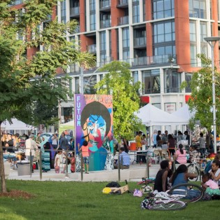 The revitalization of Regent Park (Phases 1-3) is a public-private collaboration between the Toronto Community Housing Corporation (TCHC), The Daniels Corporation (Daniels) and community residents. The goal of this effort is to convert Canada’s largest public housing community into a mixed-income, mixed-use, socially cohesive and vibrant neighbourhood. By leveraging the economic value of downtown Toronto’s real estate market, the multi-phase development is creating a socially inclusive environment for its residents by addressing the complexities of urban renewal within a context of declining public funding for social housing. Residents are guaranteed a right of return as the revitalization moves through phases of development, which include housing and numerous public amenities such as sports and cultural facilities, a community centre, retail space for national brands, small businesses and green space.