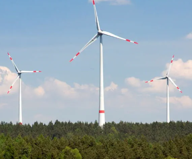 Project overview&nbsp;Located in the Upper Franconian district of Bayreuth, Bavaria, the&nbsp;Rotmainquelle Community Wind Farm&nbsp;is a 15-MW citizen-owned renewable energy project developed by Ørsted Onshore Germany (formerly OSTWIND). Commissioned between December 2015 and March 2016, the project features five Enercon E115 wind turbines and produces enough clean electricity to power the equivalent of around 12,000 German households annually, avoiding approximately 26,000 tonnes of CO₂ emissions each year.[1]&nbsp;What sets Rotmainquelle apart is its financing model: approximately 200 local citizens and two regional energy cooperatives invested a combined $5.75 million through subordinated loans. This structure ensured that financial returns from the wind farm flowed directly back into the community.&nbsp;Approach&nbsp;From the beginning, Ørsted Onshore Germany designed Rotmainquelle to prioritize local participation. The company offered qualified subordinated loans with a minimum investment threshold of just $1,150, enabling participation even from modest-income households. Investment sizes ranged from $1,110 to $55,500 and contributed directly to project construction.&nbsp;The investment offered a base return of 3.75% per year, with performance-linked bonuses pushing returns up to 6%, depending on annual energy output. Investors now receive repayments over a 10-year period beginning 2025, providing long-term, predictable income to local households.&nbsp;To keep benefits within the region, Ørsted prioritized outreach to Bavarian residents and cooperatives. For example, Wilhelm-Raiffeisen Energie eG Creußen – based near the project site – invested over $1.3 million (€1.2 million). These community investors weren’t passive stakeholders; they were actively engaged early in the development phase, which helped Ørsted gain community support, streamline permitting and avoid the delays often associated with wind power development in Germany.[2]&nbsp;Rotmainquelle is part of a broader wind cluster of five regional projects developed by Ørsted in Upper Franconia. Each project showcases a different model of local involvement – from energy cooperatives to municipally owned wind farms. Two nearby wind farms in Pegnitz, for instance, were co-developed and managed with the local city government.&nbsp;Business and economic value&nbsp;For participating citizens, the wind farm provides a stable return on investment, with annual payments reinforcing public support for renewable energy. This income distribution helps broaden the economic base of the energy transition, turning residents into direct financial beneficiaries and reducing the developer’s reliance on commercial debt, thereby reducing the project’s cost of capital.&nbsp;The project’s success has reinforced support for renewables in the region and laid the foundation for replication in other municipalities. By testing and validating a community-financed ownership model, Ørsted now has a scalable template for future citizen-led renewables – not just in Bavaria, but across markets where social acceptance and land access remain barriers. The surrounding municipalities have begun leveraging the model to create new public utilities, strengthen civic participation in energy decisions and foster economic development around clean energy assets. Local stakeholders are no longer just hosts to infrastructure – they are co-developers and long-term beneficiaries.&nbsp;Ultimately, co-ownership is a compelling model, particularly for smaller-scale projects, where it can be a win-win for communities, local authorities, the developer and energy transition. Exploring a variety of ownership and financing structures, tailored to local context, can minimize the risk of opposition and permitting delays[3] – common issues in Germany that can lead to project cancellations and sunk costs of up to $7.5 million.[4]References:&nbsp;&nbsp;Onshore-Windpark Rotmainquelle | Ørsted&nbsp;Larg﻿e-scale wind and solar developers concerned about social factors affecting deployment | Energy Markets and Policy Berkley Lab&nbsp;Renewable energy projects are facing increased delays, cancellations, and big losses - EUCI&nbsp;Larg﻿e-scale wind and solar developers concerned about social factors affecting deployment | Energy Markets and Policy Berkley Lab&nbsp;