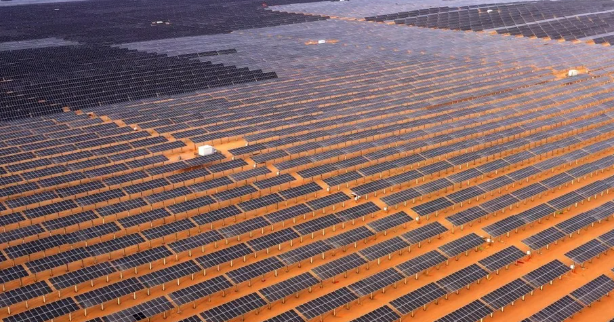 Project overviewThe Ningxia Tengger Desert Renewable Energy Project, led by Longyuan Power, is China’s first large-scale renewable energy base in a desert ecosystem, serving both climate and ecological goals. Situated in the Tengger Desert, the project aims to generate clean electricity while tackling land degradation through integrated design. With a planned installed capacity of 13 GW and a total investment of approximately USD 12 billion, the project forms part of China's broader “Desert, Gobi, and Wasteland” clean energy strategy under its dual carbon goals. Phase 1 includes a 1 GW solar photovoltaic array.&nbsp;ApproachTo accommodate the arid desert terrain, Phase 1 solar modules are elevated to 3 meters above ground, creating space below for vegetation restoration, agricultural use, and sand control. This “PV+” model blends solar generation with forestry-solar and agrivoltaic approaches to promote land productivity and ecosystem recovery.&nbsp;Sand control techniques include straw checkerboards combined with native grass seed broadcasting. Pilot programs have also tested biological soil crusts and adaptive planting strategies to improve soil stability and biodiversity. Intelligent tracking systems optimize the angle of single-axis solar trackers in real-time using wind speed sensors and solar trajectory calculations, helping safeguard support structures during high-wind events.&nbsp;The project integrates dynamic environmental monitoring, site-wide automation, and grid-friendly power infrastructure to improve renewable energy dispatch rates. Smart controllers and tilt sensors are embedded into the infrastructure, enabling real-time performance adjustments to changing climatic and soil conditions.&nbsp;Business and economic valueOnce fully operational, the 1 GW Phase 1 project will generate approximately 1.8 TWh of electricity annually—enough to power 1.5 million households—while improving system efficiency by 5% through intelligent tracking. This optimization boosts total energy output and strengthens the project’s revenue and return-on-investment outlook across a 25-year operational life.&nbsp;The project also unlocks economic value through ecosystem services. Following vegetation restoration, plant diversity has expanded from 1–2 species to 6–8, with coverage increasing from 0.5% to 20%. More than 1,700 hectares of the 1,900-hectare site have undergone successful sand control. These interventions reduce erosion risk and enhance biodiversity, while offering long-term climate and adaptation co-benefits.&nbsp;In addition to environmental gains, the project generated significant employment during construction and operations. It has also supported rural revitalization through afforestation, agricultural co-use, and land lease income for local communities. By combining smart infrastructure, ecological restoration, and dual land use, the project demonstrates how clean energy deployment in arid and degraded environments can deliver measurable impact across climate, environment, and economy—offering a scalable model for other regions seeking integrated energy and landscape solutions.&nbsp;References:Longyuan Power launches 1-GW solar PV project in Tengger Desert - China Energy NewsChins desert, Gobi and wasteland energy base development strategy - National Energy Administration of ChinaTengger Desert Renewable Base Phase I Overview - Longyuan Power GroupSmart renewable energy infrastructure practices in arid regions - State Grid Corporation of ChinaChinas desert solar projects fight climate change and desertification - CGTNPV+ model powers green transformation in Chinas desert regions - Global Times